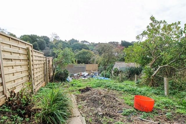 The large rear garden has potential