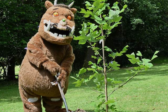 The Gruffalo planting a QGC tree at Framfield Grange near Uckfield in May 2022