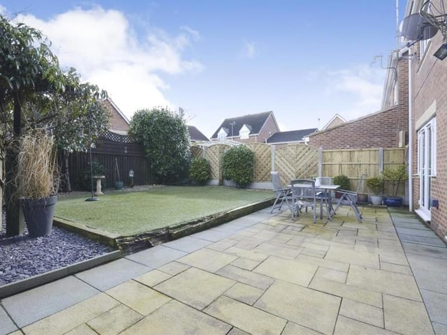 Another view of the pleasant and private garden at the rear of the Millrise Road property. Sit back and let the weather do the rest.