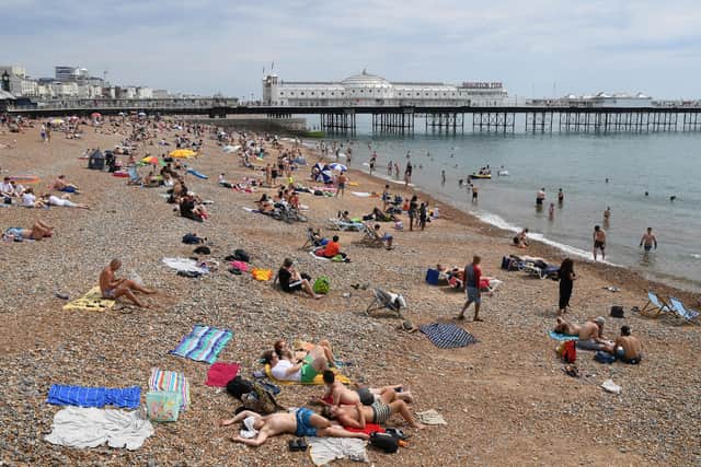 Sussex is set to sizzle this week as a heatwave sweeps across the UK but does it ever get hot enough to be sent home from work? Picture by Mike Hewitt/Getty Images