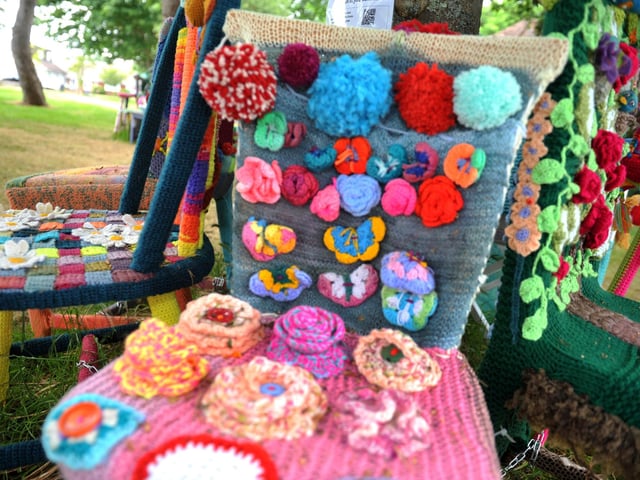 East Preston Yarnbombers have created an enchanting picnic area with chairs that are beautifully-decorated knitted masterpieces