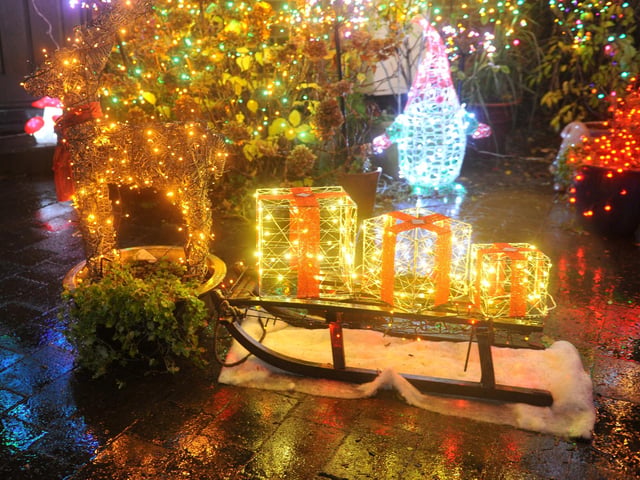 Lights shaped like Christmas presents on a sled