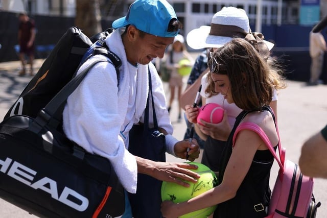 EASTBOURNE, ENGLAND - JUNE 25: Ryan Peniston of Great Britain signs autographs for fans during Day Two of the Rothesay International Eastbourne at Devonshire Park on June 25, 2023 in Eastbourne, England. (Photo by Charlie Crowhurst/Getty Images for LTA):Images from day two at the Rothesay tennis international at Devonshire Park, Eastbourne