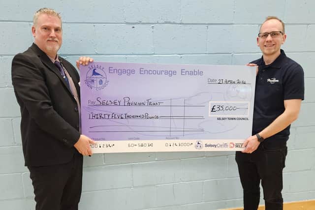 Cllr Andrew Brown, presenting the cheque to Christian Skelton, Chairman of the Selsey Pavilion Trust