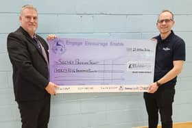 Cllr Andrew Brown, presenting the cheque to Christian Skelton, Chairman of the Selsey Pavilion Trust