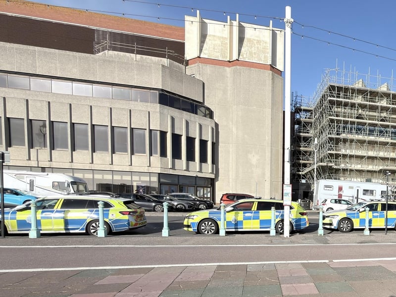 Police vehicles on Brighton seafront.