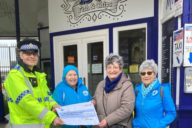 PCSO Dan Russell from Eastbourne Police, presented representatives from Friends of Eastbourne Seafront with a cheque for £500 on Tuesday, February 6. Picture: Eastbourne Police