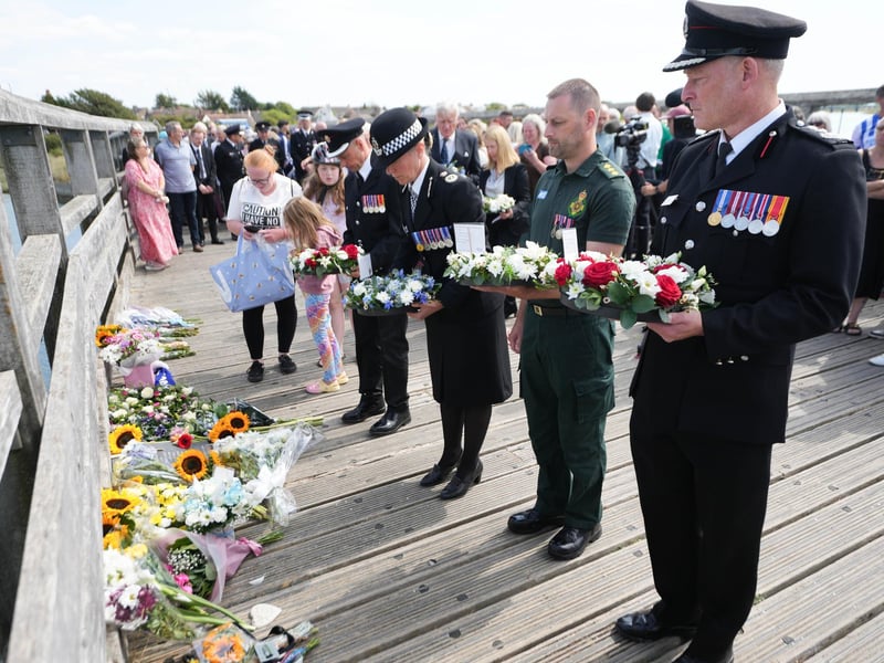 Emergency services lay wreaths on the Shoreham Old Tollbridge