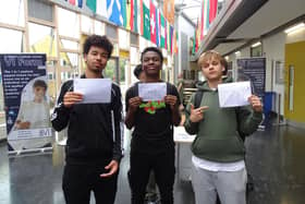 From left: David, Daniel and Orestas with their GCSE results