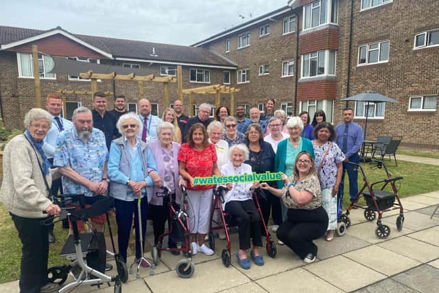 Crawley Borough Council and Wates staff with Carey House residents