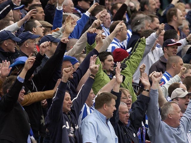 Brighton fans celebrate becoming Division Two champions after the Nationwide Division Two match between Brighton and Hove Albion v Swindon Town at the Withdean Stadium.