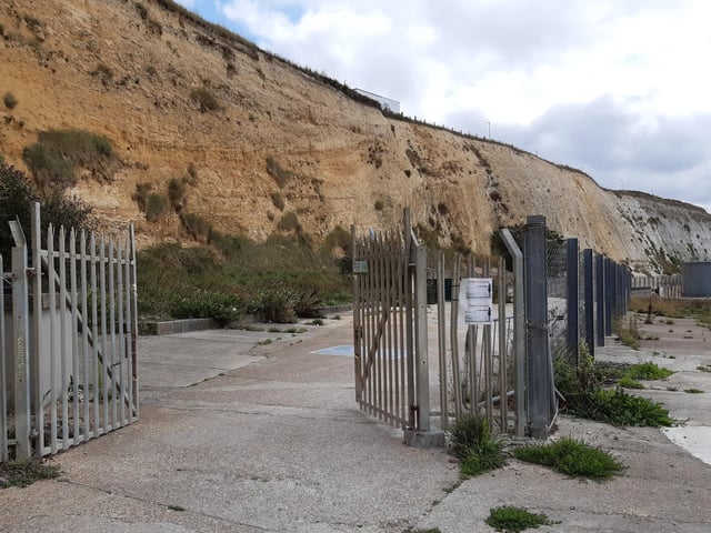 Go through the gates to the Undercliff Walk