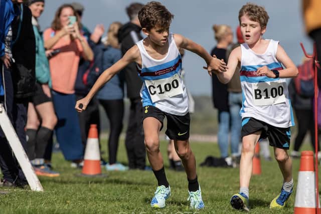 Eastbourne Rovers juniors at a handover in the Sussex relays at Goodwood
