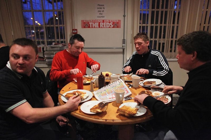 Crawley Town fans enjoy breakfast at the Pelham Buckle pub before boarding coaches to Manchester to watch their team take on Manchester United.