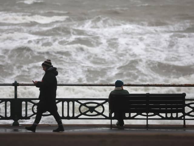 The Met Office has warned there is a 'small chance' that injuries and danger to life 'could occur' from large waves and beach material being thrown onto sea fronts, coastal roads and properties. (Photo taken in Brighton by Peter Nicholls/Getty Images)