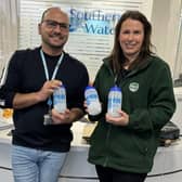 Daniel Rodrigues from Southern Water and Rachel from HILS showcasing the HILS client water bottles