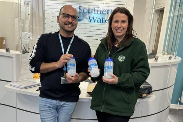 Daniel Rodrigues from Southern Water and Rachel from HILS showcasing the HILS client water bottles