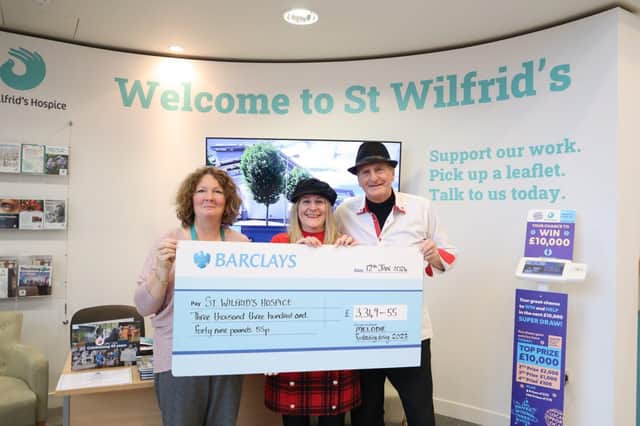 Melodie's Pam and Alan present the cheque to Michele