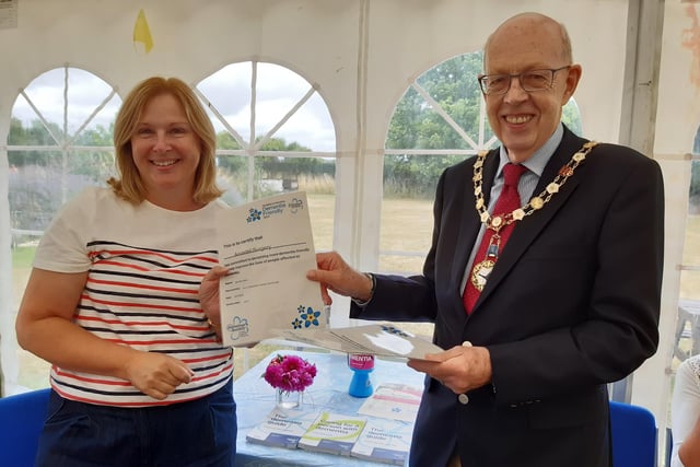 Arundel mayor Tony Hunt presents the Dementia Friendly 2022 certificate for The Arundel Surgery