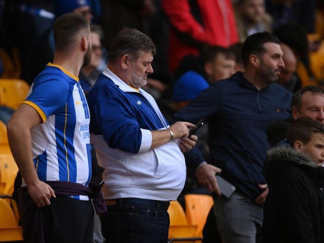 WOLVERHAMPTON, ENGLAND - NOVEMBER 05: A fan uses their phone prior to the Premier League match between Wolverhampton Wanderers and Brighton & Hove Albion at Molineux on November 05, 2022 in Wolverhampton, England. (Photo by Mike Hewitt/Getty Images)