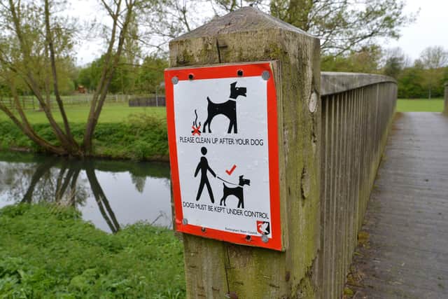 Dog controls sign