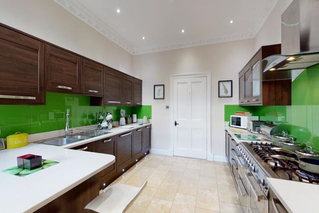 The house has a modern kitchen with a gas stove.