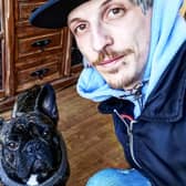Eastbourne shop owner Thomas Meredith with his dog