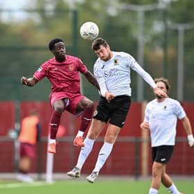 Ashley Nadesan goes airborne during Horsham's FA Cup clash at Walton & Hersham in September. Picture by McCartney Martin