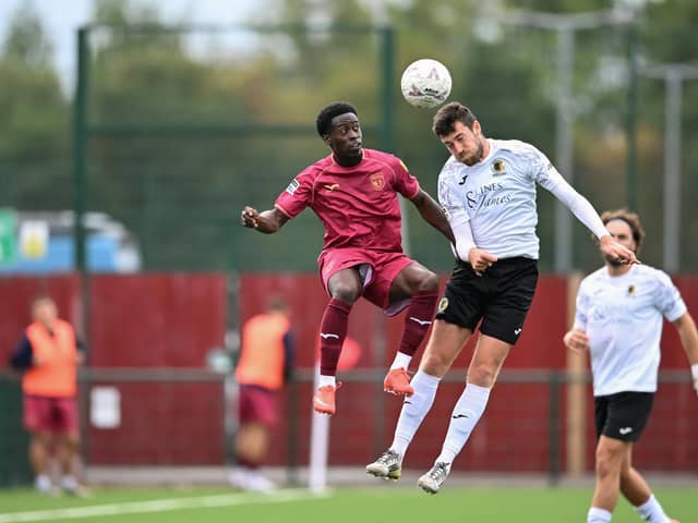 Ashley Nadesan goes airborne during Horsham's FA Cup clash at Walton & Hersham in September. Picture by McCartney Martin
