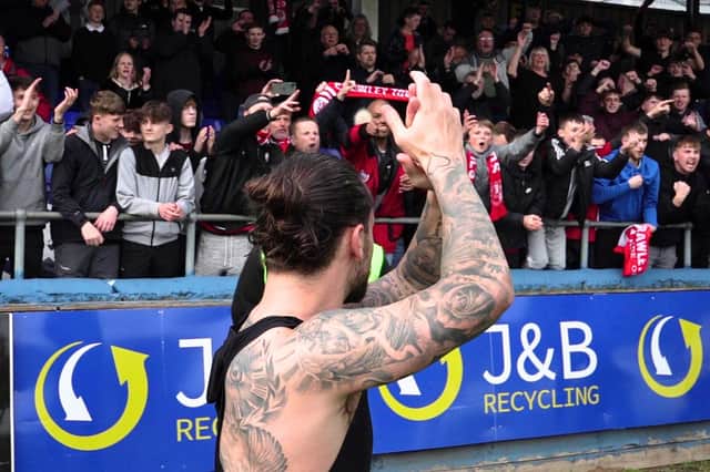 Dom Telford celebrates with Crawley Town fans