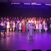 Burgess Hill Girls students demonstrate their singing skills on stage