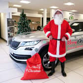 Santa collecting his specially decorated Skoda Kodiaq at Station Garage, Broadbridge Heath.