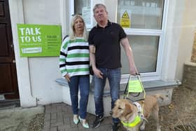 Carol Collis and Mark White with Embry the guide dog. Photo: staff