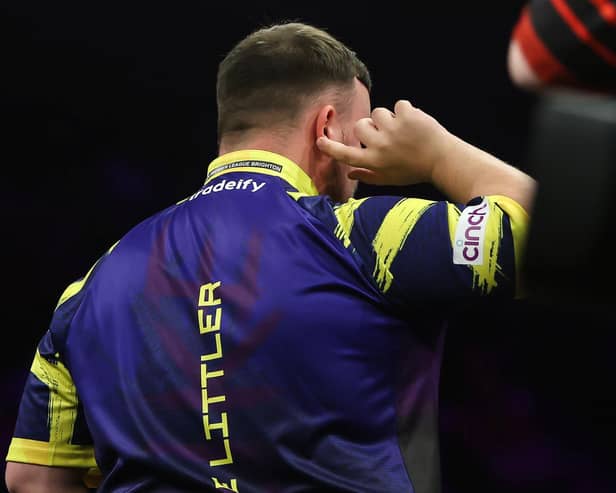 Two-time world champion Luke Littler endured a difficult night in Brighton, as he was booed by sections of the crowd and knocked out in the quarter-finals by Stephen Bunting. Photo: Taylor Lanning/PDC
