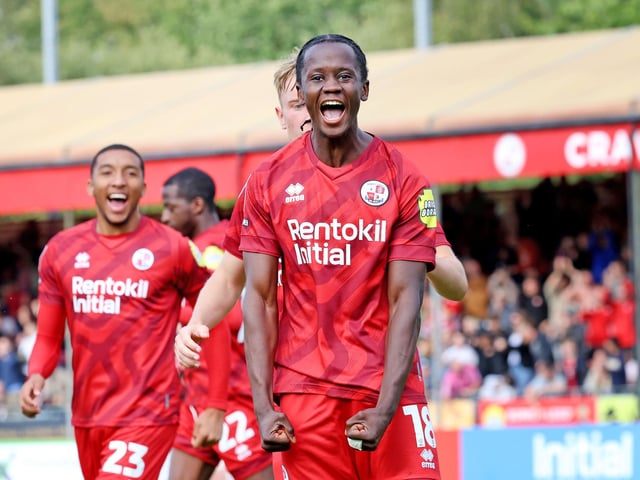 Crawley's Armando Quitirna equalises from the penalty spot against Stockport and celebrates