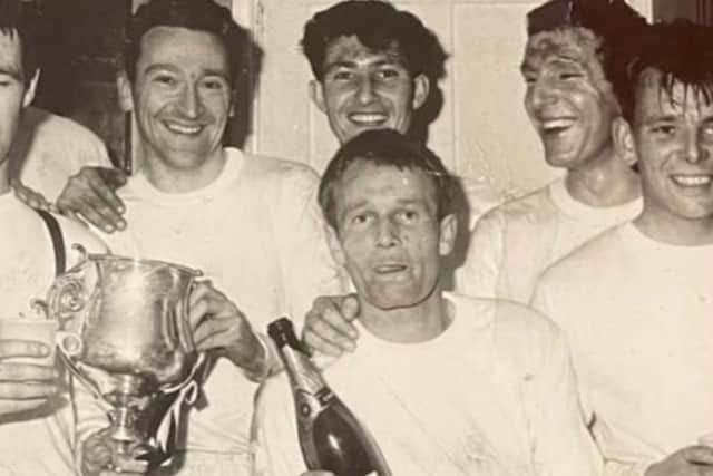 Eddie Woods - centre - celebrating a trophy win with his team-mates  | Picture via EUFC