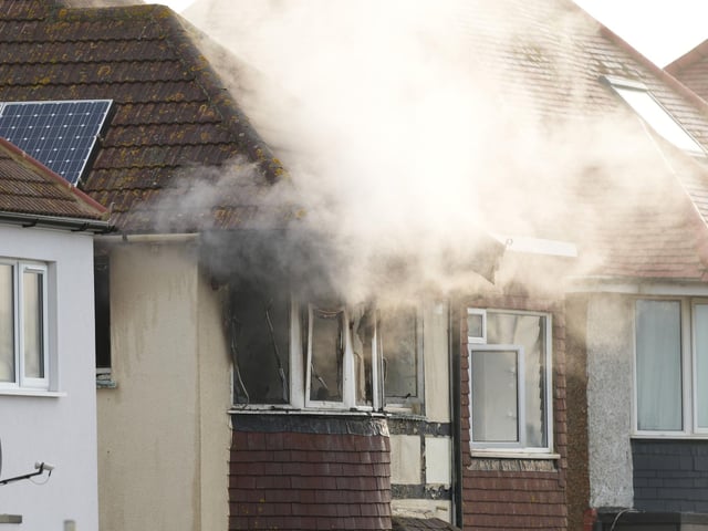An 86-year-old woman has died in a residential property fire in Sussex.