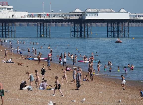 Plans to almost halve lifeguard services across Brighton and Hove have been approved following a council budget meeting.