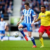 BRIGHTON, ENGLAND - APRIL 25:  Greg Halford of Brighton and Troy Deeney of Watford tackle for the ball during the Sky Bet Championship match between Brighton & Hove Albion and Watford at Amex Stadium on April 25, 2015 in Brighton, England.  (Photo by Jordan Mansfield/Getty Images)