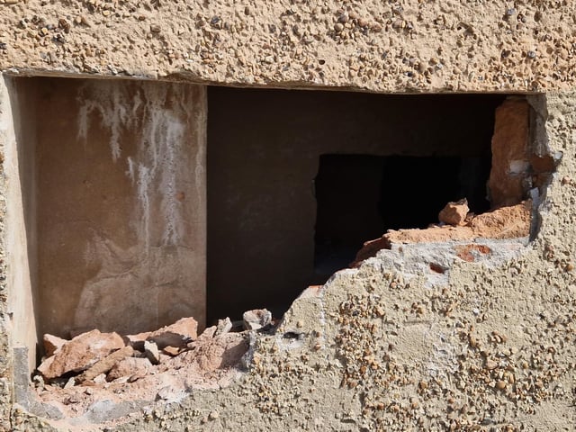 Pete Coe, one of the project leaders, and fellow former Royal Engineer Graham Cosham worked together to open the southern embrasure at the Ferring pillbox