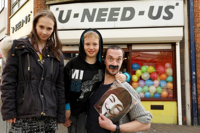 Matthias Hepworth and his children, Ben, 8, and Sophia, 11, outside U-Need-Us on its last day of trading. Picture: Chris Moorhouse (300319-20)