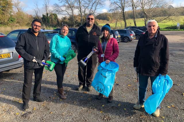 Volunteers clearing up dog mess from a Worthing beauty spot