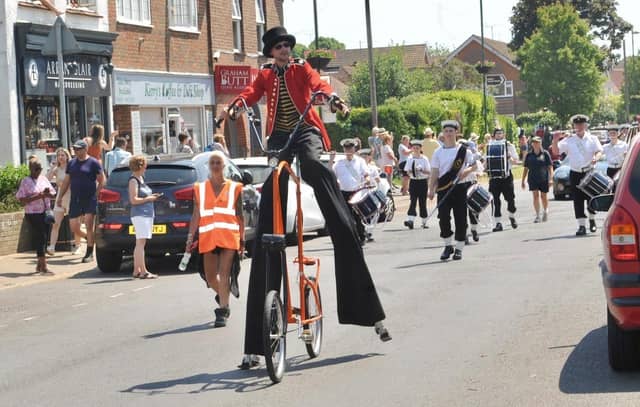 The floats and walking groups proceeded through the village in colourful and imaginative costumes with crowds of spectators lining the streets to cheer them on