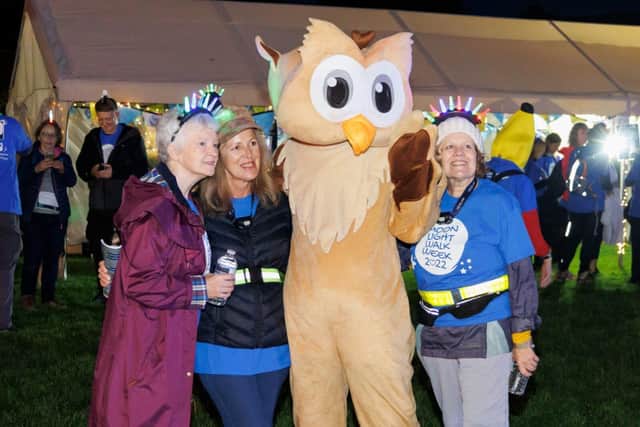 Walkers at the 2022 Moonlight Walk with Wilf, one of the St Wilfrid's Hospice owl mascots