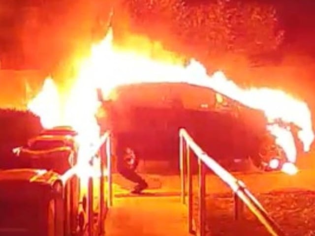 One of the cars set on fire. Picture from Sussex Police