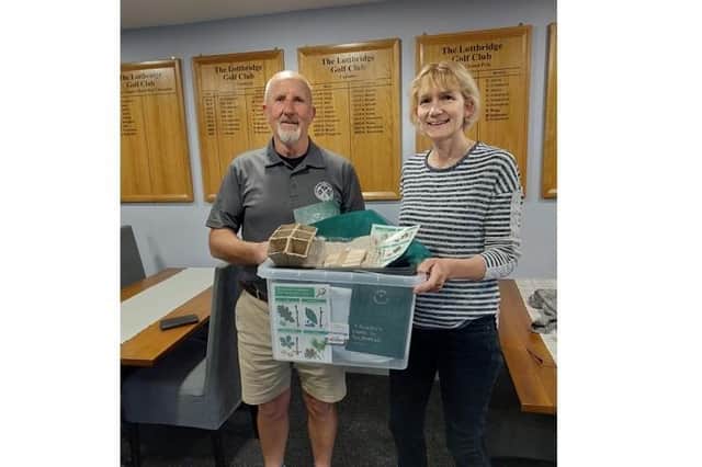 Ray Cruttenden and Jules Woodward with the tree-planting kit