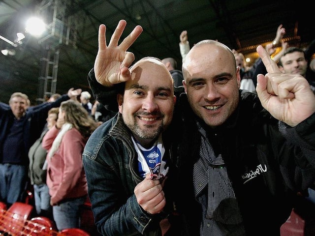 Brighton fans celebrate their teams 1-0 victory after the Coca-Cola Championship match between Crystal Palace and Brighton and Hove Albion at Selhurst Park on October 18, 2005.