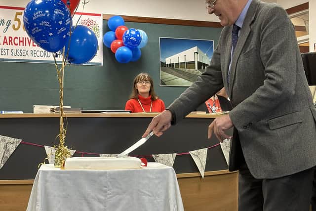 Lord Egremont cuts the cake. Photo: Connor Gormley
