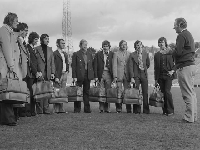 Assistant manager Peter Taylor IS pictured on far right having a team talk with his players on the pitch at Brighton's Goldstone Ground in Hove prior to a match on 17th November 1973.