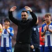 Roberto De Zerbi, manager of Brighton & Hove Albion, acknowledges the fans after the final whistle of the Premier League match at Aston Villa